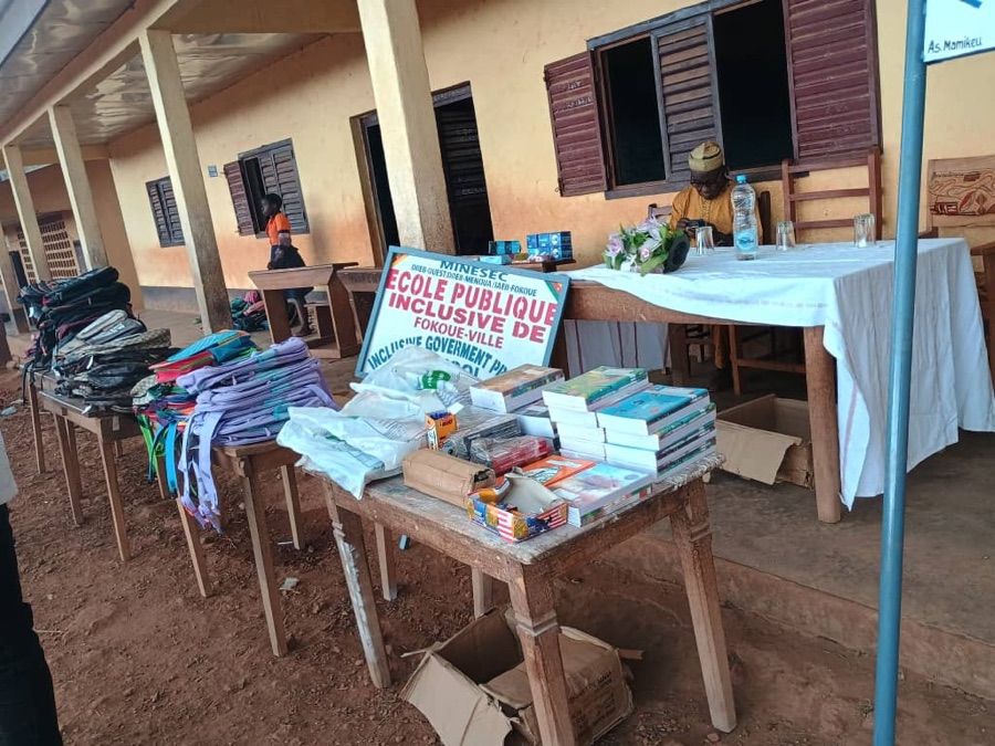Bags, exercise books and supplies of the 2026 kit laid out before the handover